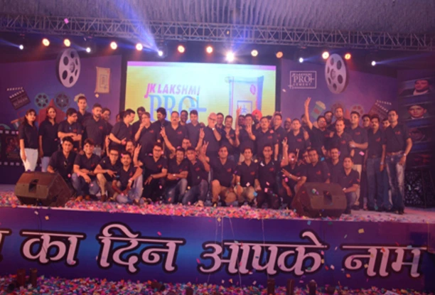 Team event with stage lights and branding