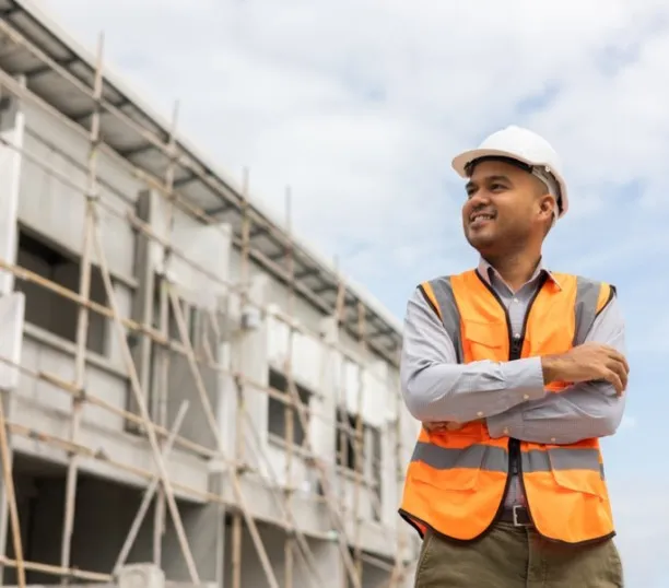 Man with construction cap and vest