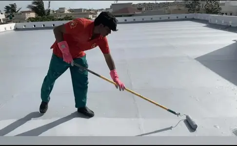 Man mopping cement